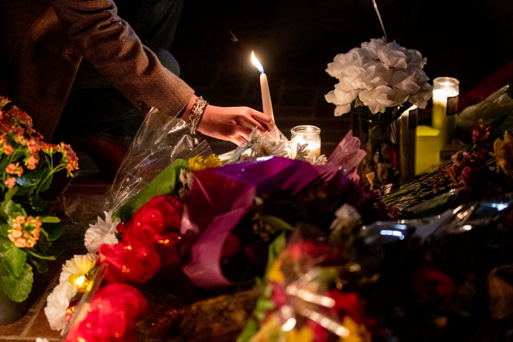 candle at Monterey Park vigil