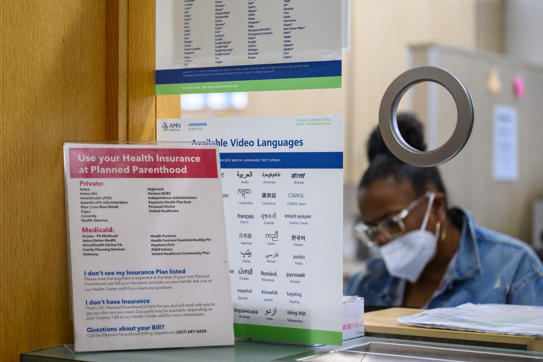 Signs at a reception window at a Planned Parenthood