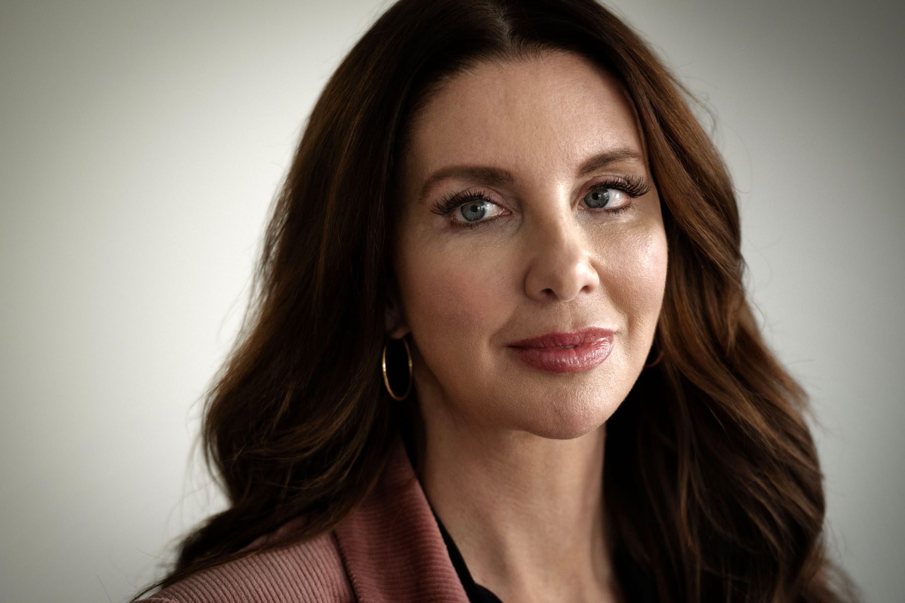 Portrait of Shannon Watts, founder of Moms Demand Action, smiling softly.