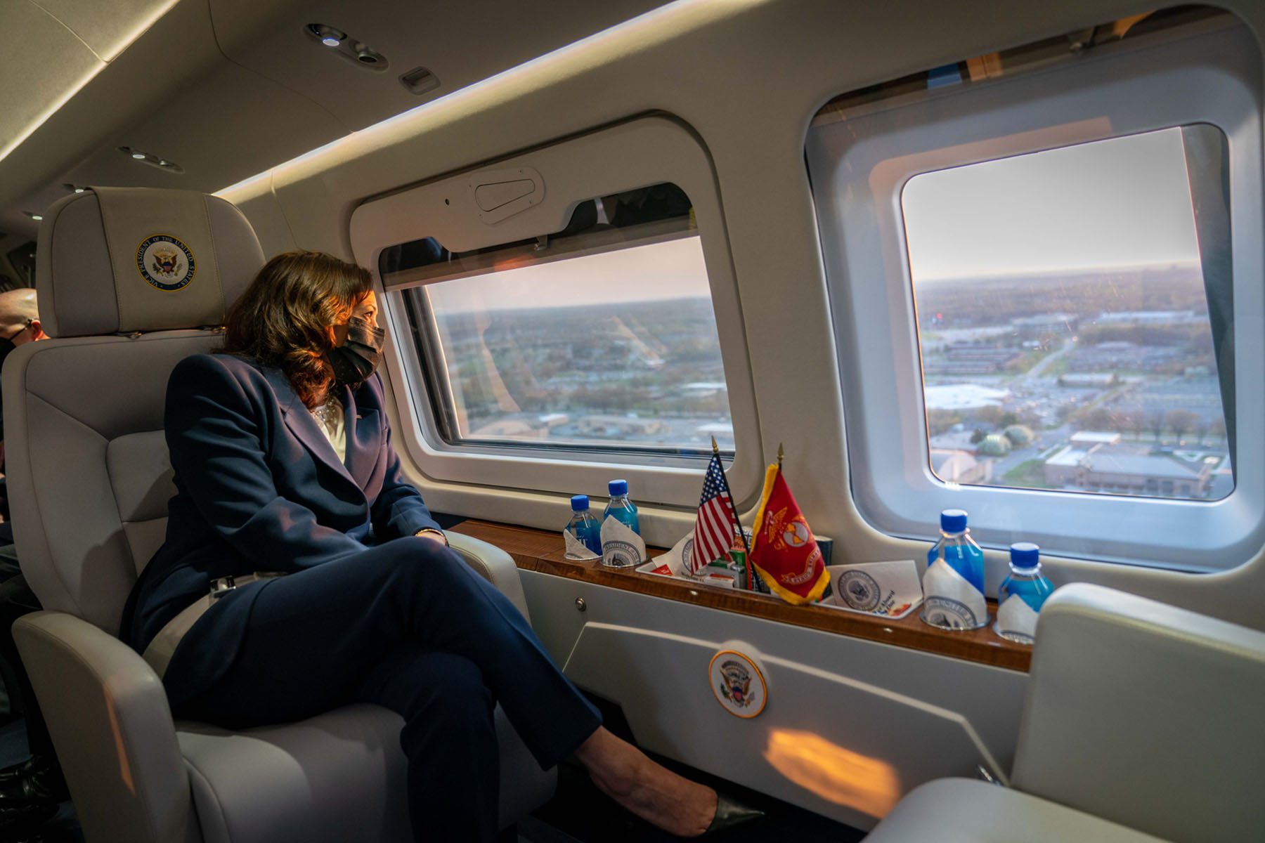 Kamala Harris looks out the windows of Marine Two as she flies over Washington, D.C.