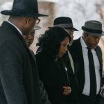 RowVaughn Wells, mother of Tyre Nichols, walks into Mississippi Boulevard Christian Church for her son's funeral service with family and civil rights attorney Ben Crump by her side.