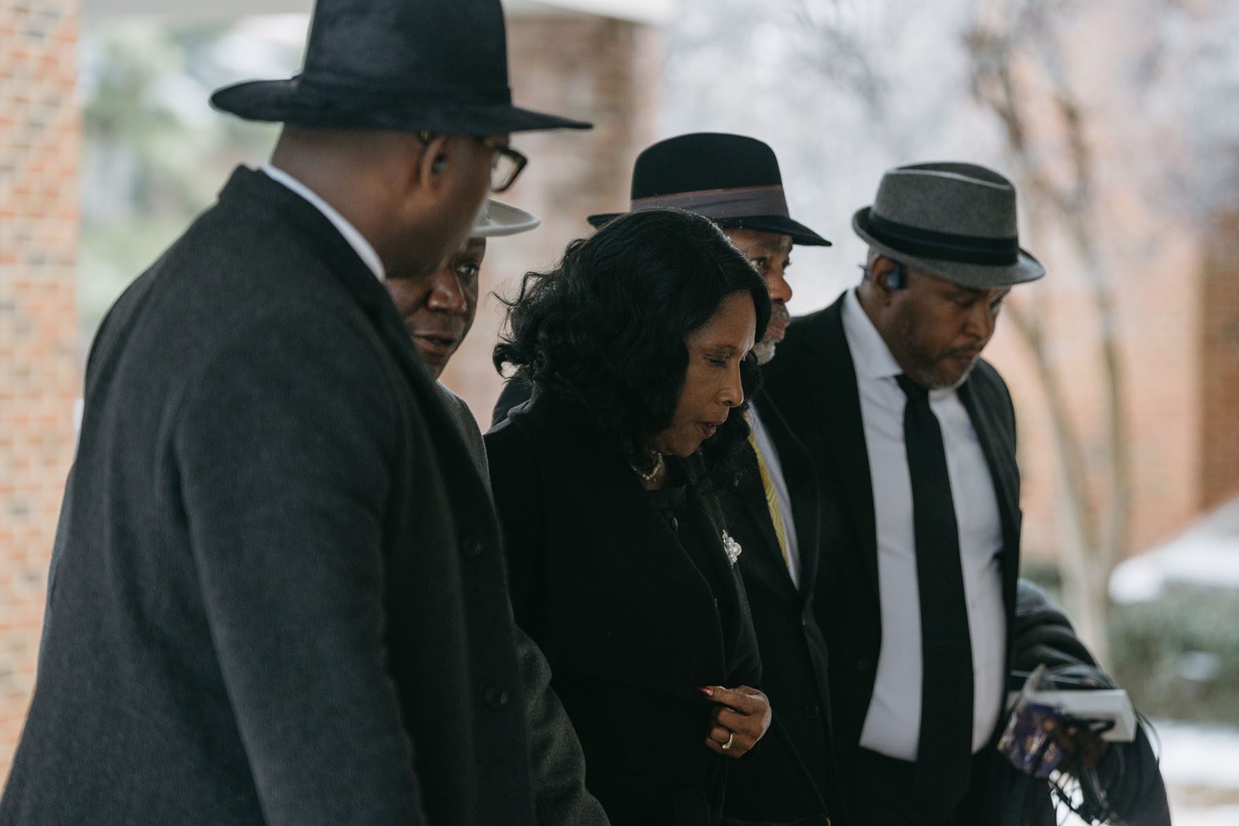 RowVaughn Wells, mother of Tyre Nichols, walks into Mississippi Boulevard Christian Church for her son's funeral service with family and civil rights attorney Ben Crump by her side.