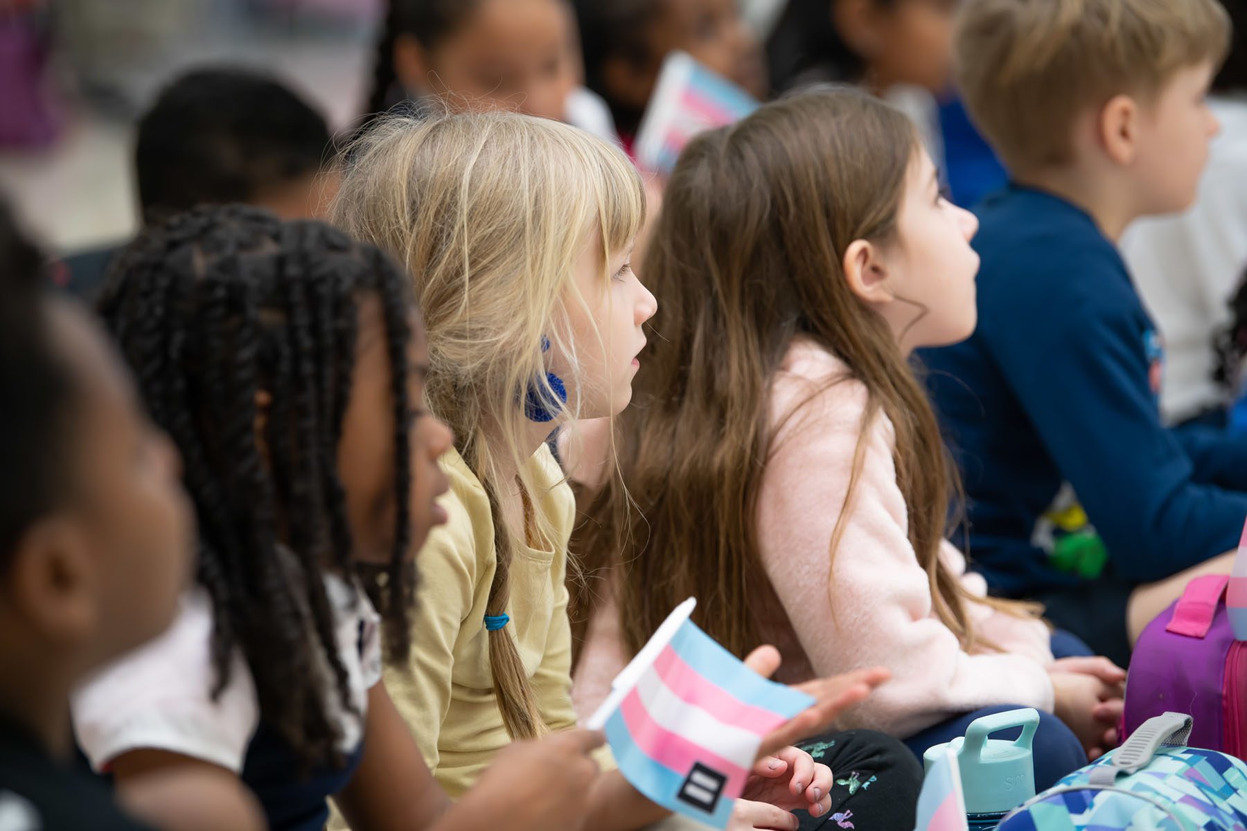 Young students listen to a reading of "