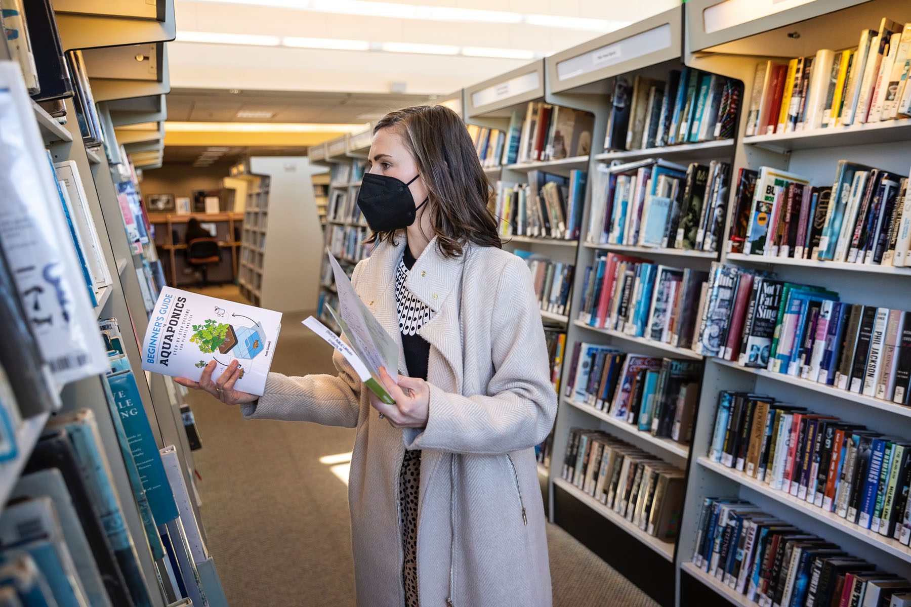 Samantha Hull looks through books at the Ephrata Public Library.