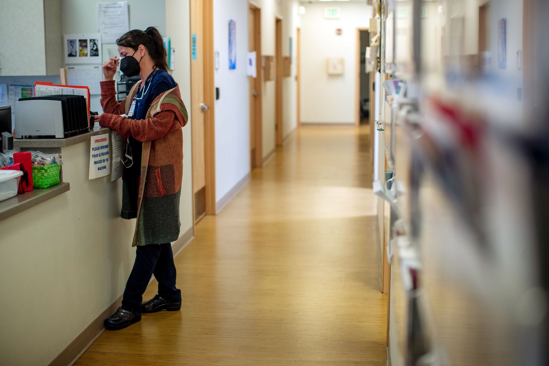 A family physician waits to consult with another doctor before a surgical abortion.