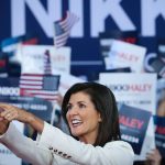 Republican presidential candidate Nikki Haley smiles as she points to supporters at her first campaign event.