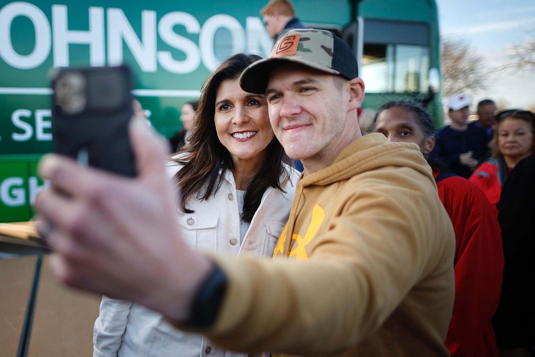 Nikki Haley smiles as she poses for selfies with supporters of Sen. Ron Johnson during a campaign rally.