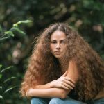 Sage Lenier poses for a portrait in a jungle in Honolulu, Hawaii