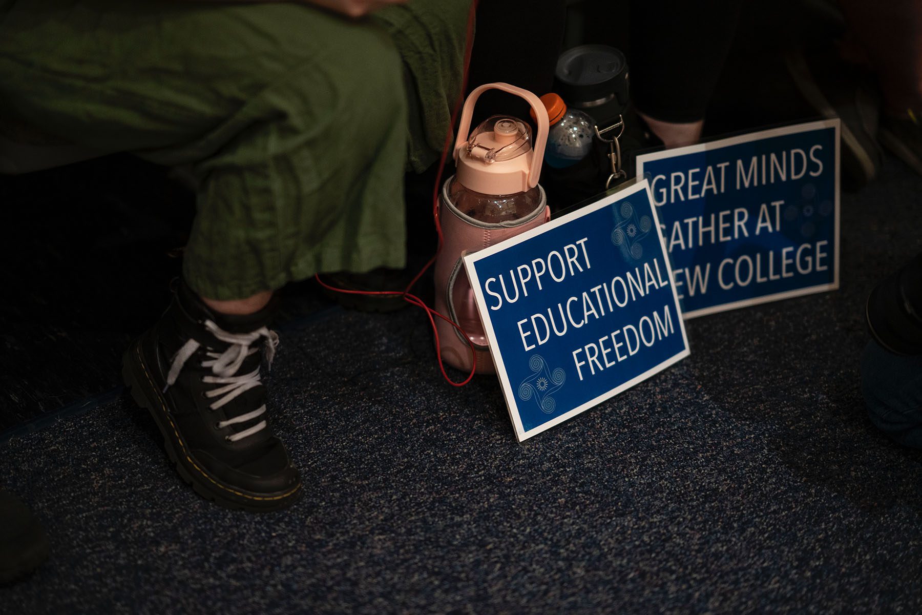 Signs that read "Support Educational Freedom" are seen on the campus of New College of Florida.