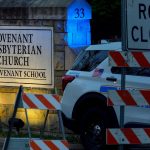 A Nashville police car blocks the entrance of the Covenant School in Nashville.