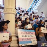 People gather at the Texas State Capitol to protest efforts to pass legislation that would restrict the participation of transgender student athletes in sports.