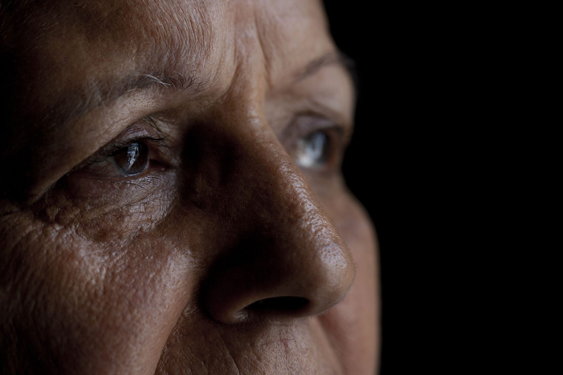 Close-up portrait of a woman looking away