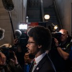 Justin Pearson is surrounded by media as he gives an interview in the Tennessee State Capitol.