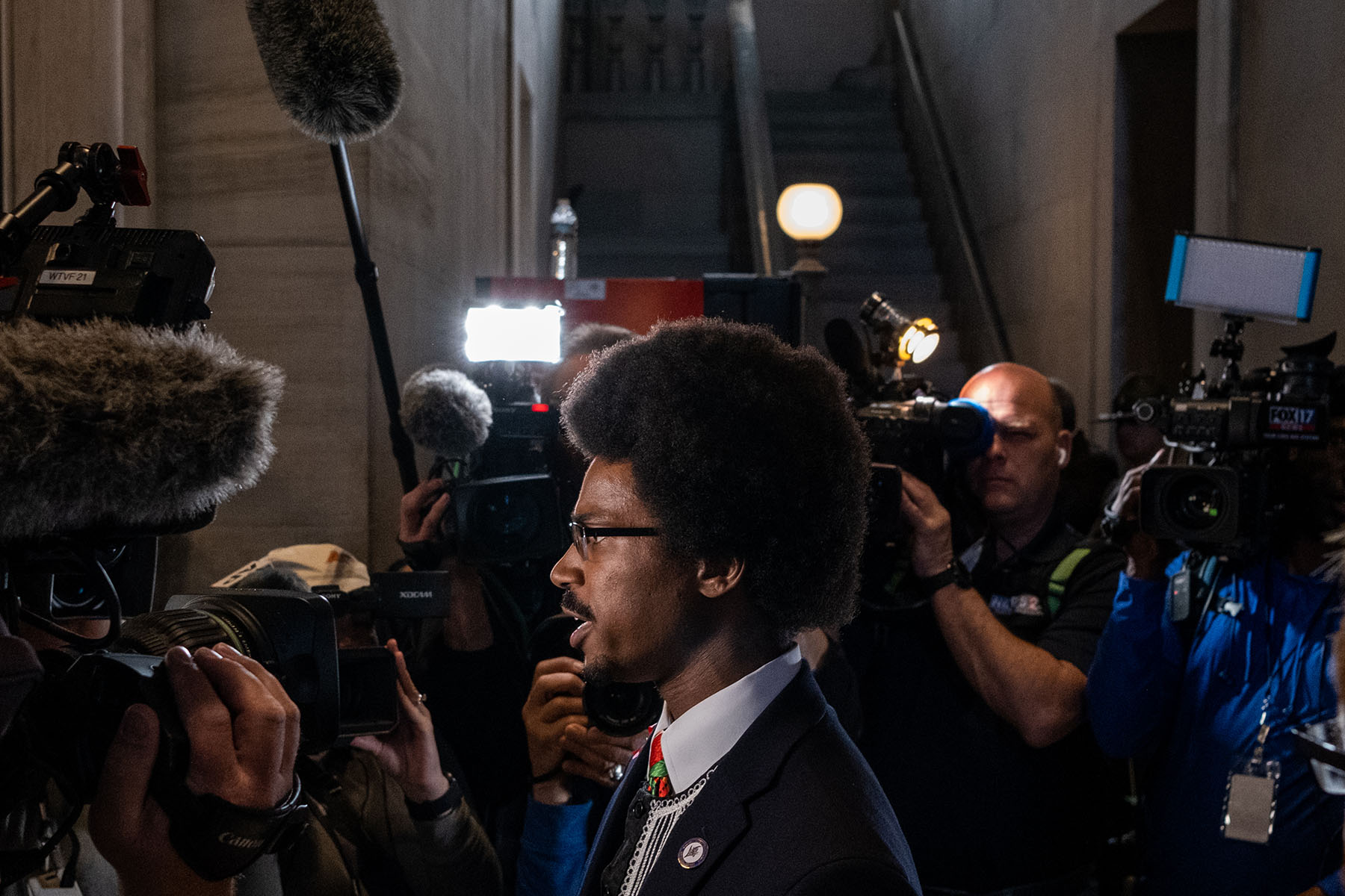 Justin Pearson is surrounded by media as he gives an interview in the Tennessee State Capitol.