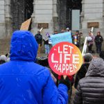 Anti-abortion activists gather in the snow at the Colorado Capitol on April 4, 2023, to protest a package of reproductive health bills.