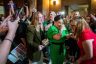 State Sens. Megan Hunt, Jen Day and Sen. Machaela Cavanaugh embrace while being cheered on by supporters after a bill seeking to ban abortions in Nebraska after about six weeks failed to advance.