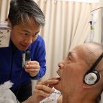 Richard Lui and his father, who has diagnosed with Altzheimer's 8 years ago. Richard Lui holds a note that reads 