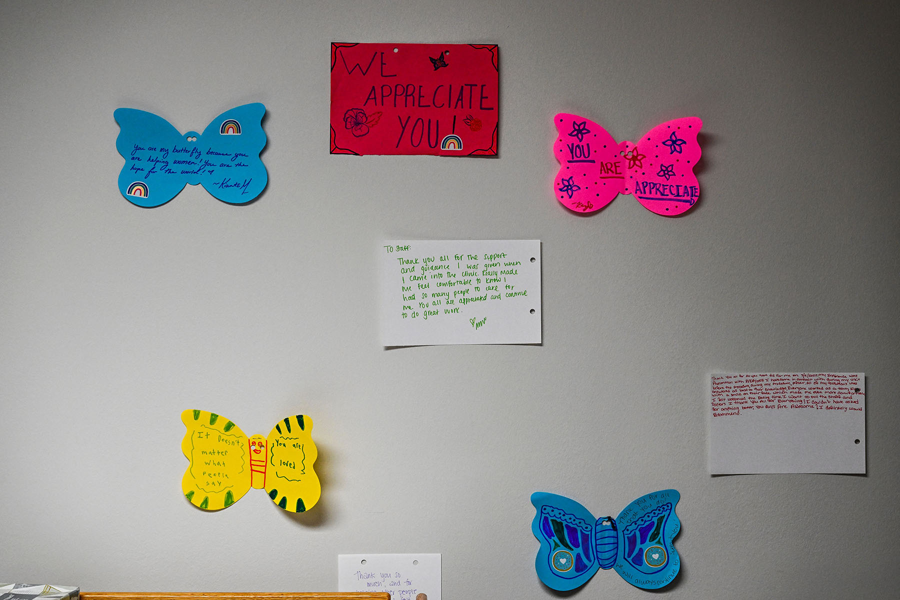 Notes written by patients for doctors are seen on a wall at a Planned Parenthood Abortion Clinic.