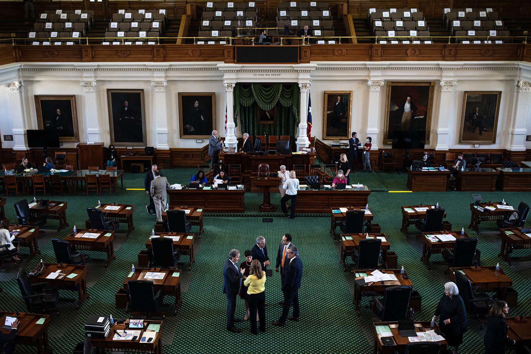 Texas state senators are gathered at the State Capitol in Austin, Texas.