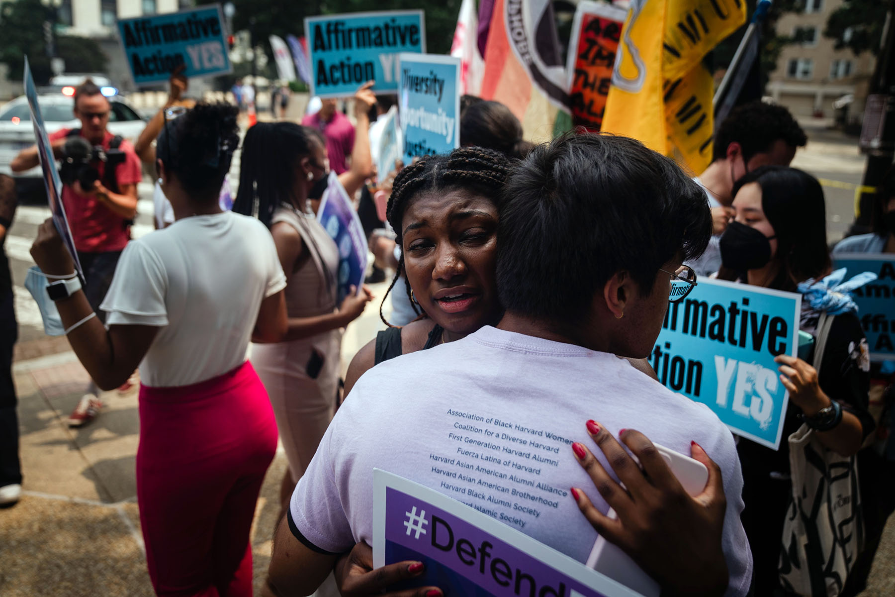 Harvard students Nahla Owens and Kashish Bastola hug outside the Supreme Court.