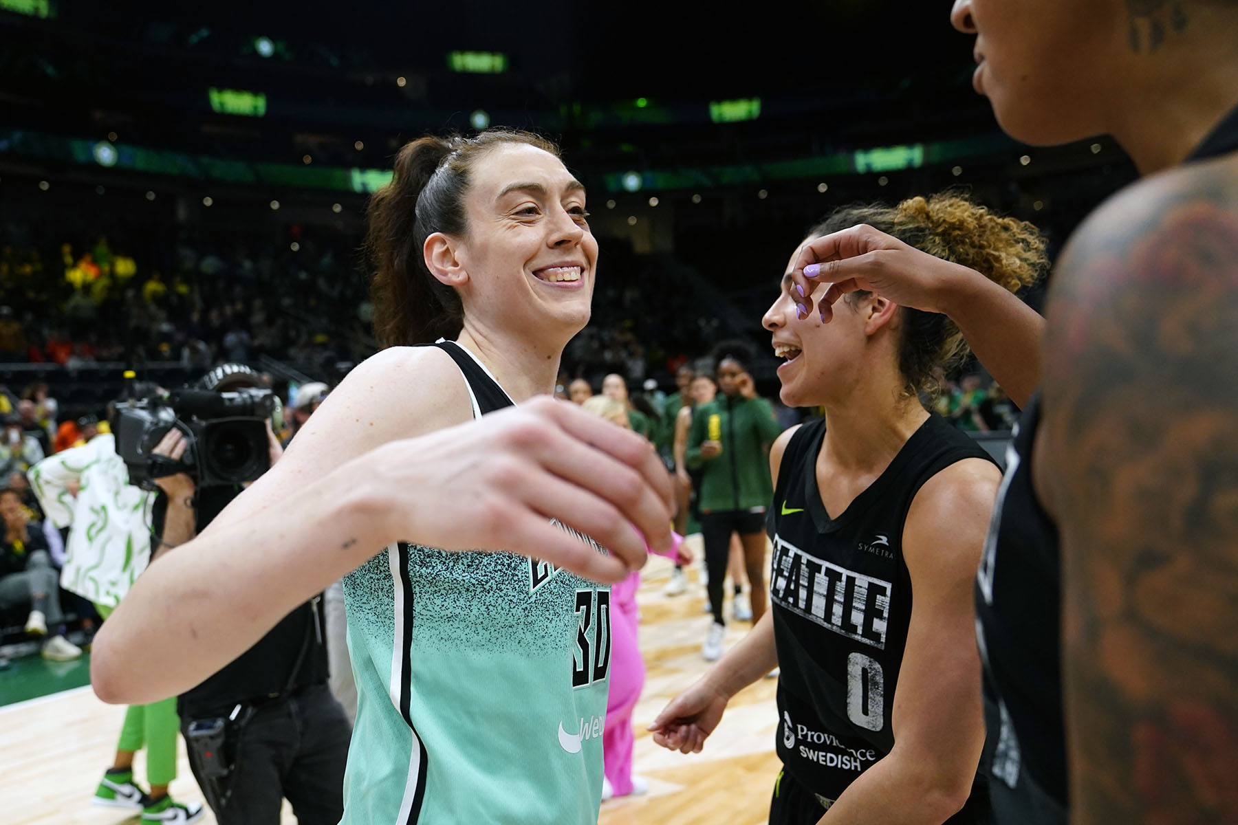 Breanna Stewart greets players following a WNBA basketball game in May 2023, in Seattle.