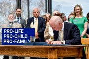 Montana Gov. Greg Gianforte signs a suite of bills aimed at restricting access to abortion during a bill signing ceremony on the steps of the state Capitol.