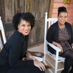 Twin sisters Jo and Joy banner smile while posing for a portrait.