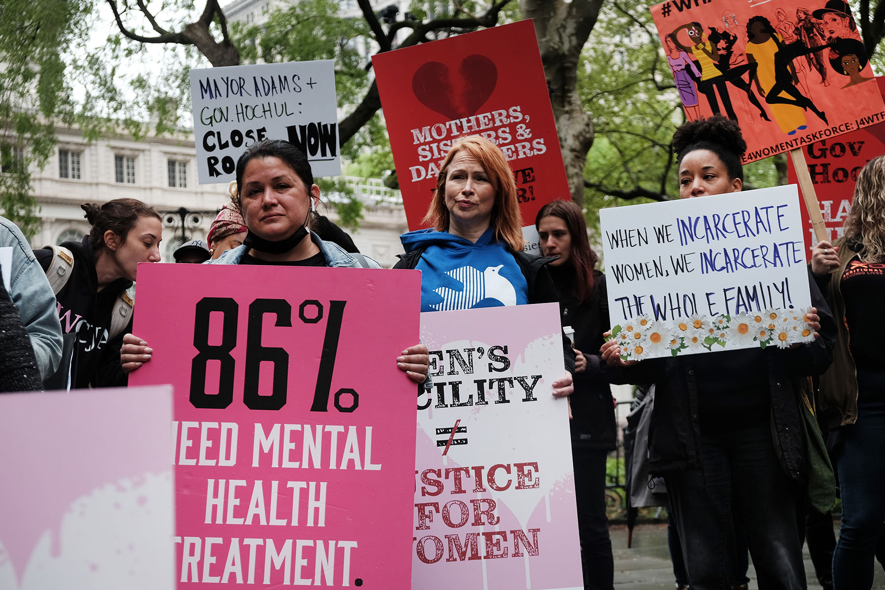 People rally in front of City Hall to demand the closing of the Rosie M. Singer Center at Riker's Island jail.