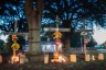 Candles burn at memorials for Angela Carr, Anolt Joseph Laguerre Jr. and Jerrald Gallion near the Dollar General store where they were shot and killed.