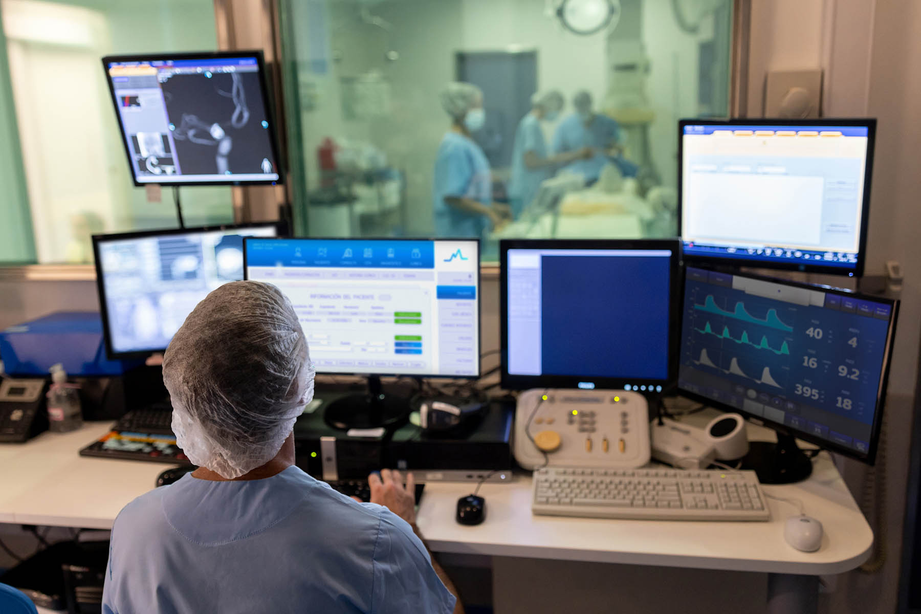 Doctor in the control room performing a hemodynamics scan.