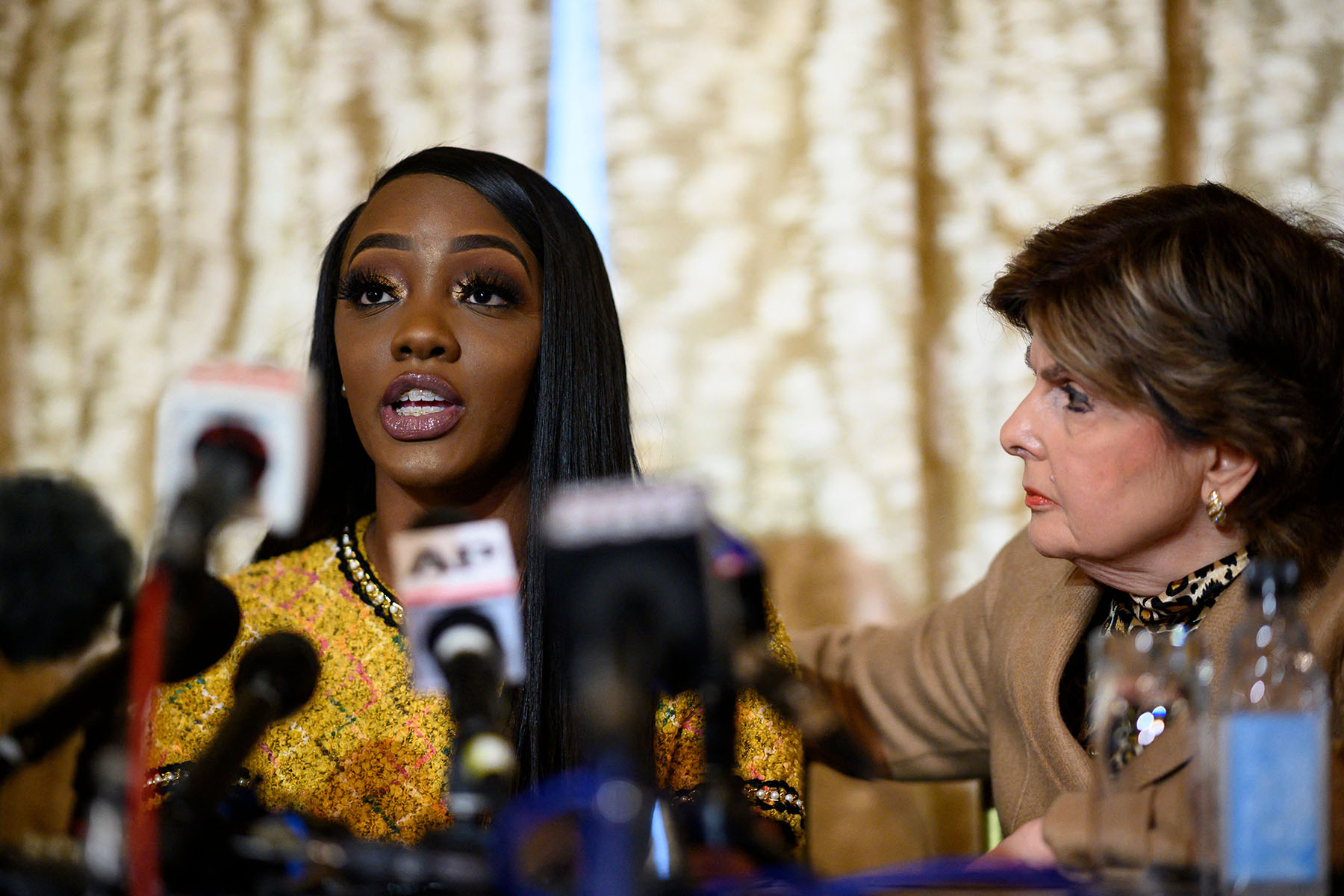 R. Kelly survivor Faith Rodgers and attorney Gloria Allred speak during a press conference.