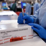 A sexual assault evidence collection kit is checked in by a forensic analyst for testing.