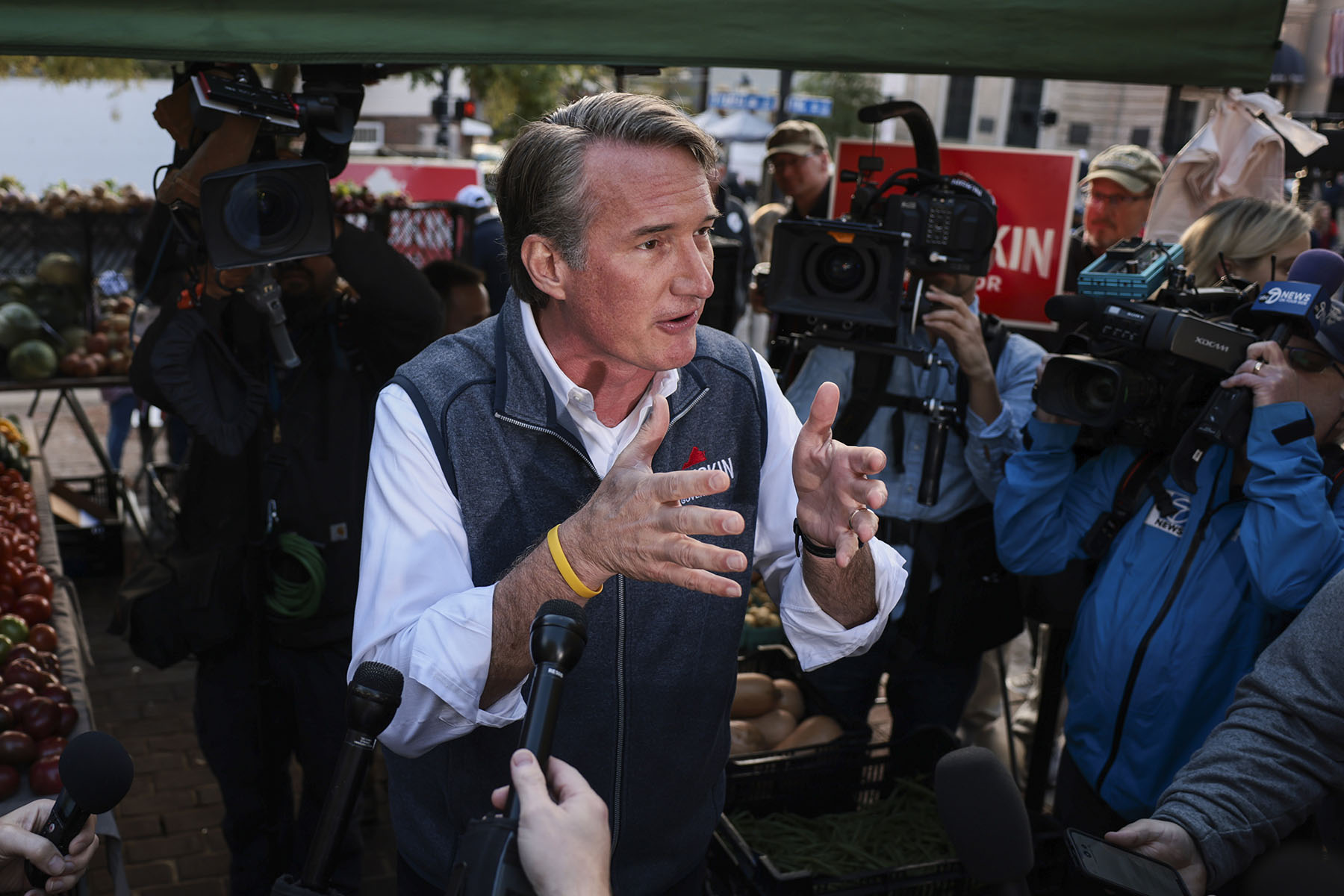 Glenn Youngkin speaks to reporters after an event.