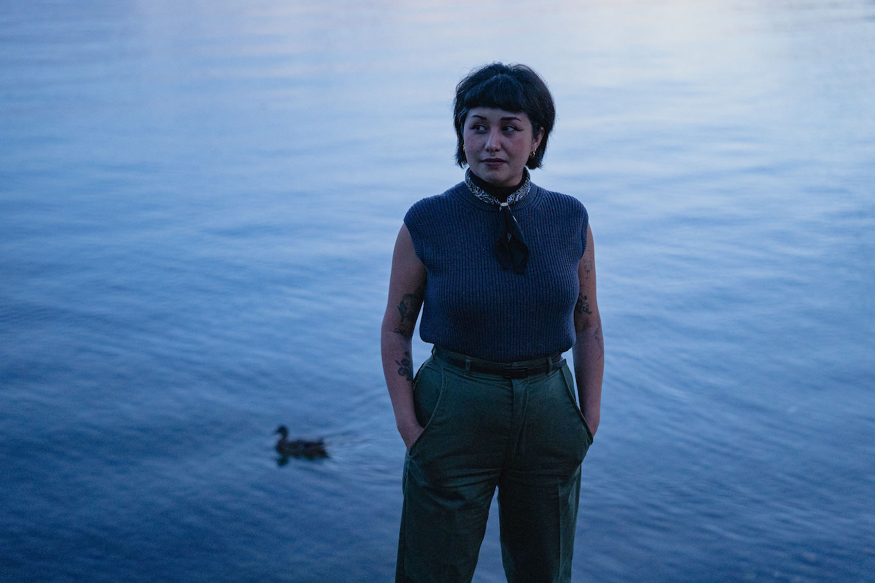 Michelle Barboza “MB” Ramirez poses for a portait in front of a lake in a Seattle park.