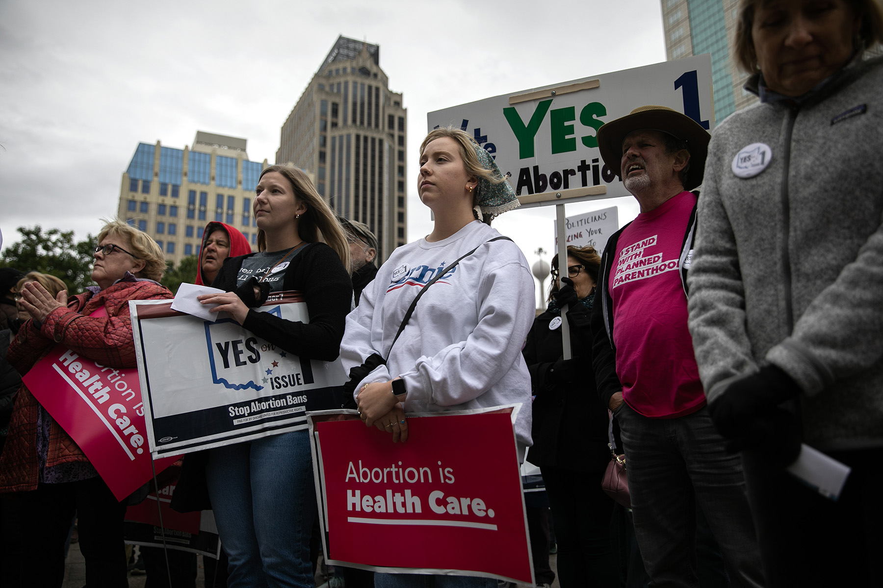 People attend a rally hosted by Ohioans United for Reproductive Rights outside of the Ohio Statehouse.