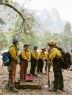 Members of the all-women wildland fire crew are briefed by their leader for the day’s tasks.