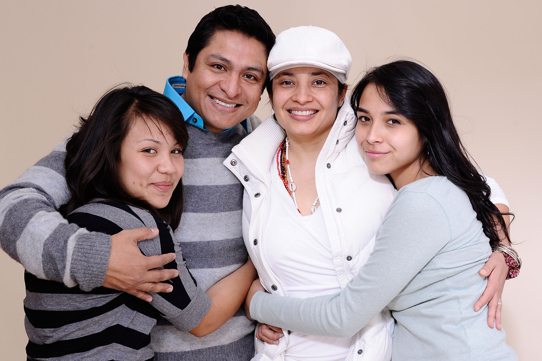 Fenessa Pineda, Omar Leyva, Aurora Guerrero and Venecia Troncoso pose for a portrait together.