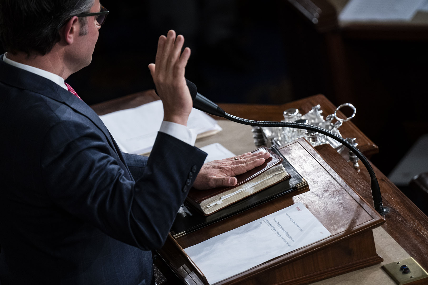 Newly elected House Speaker Rep. Mike Johnson takes the oath of office on Capitol Hill.