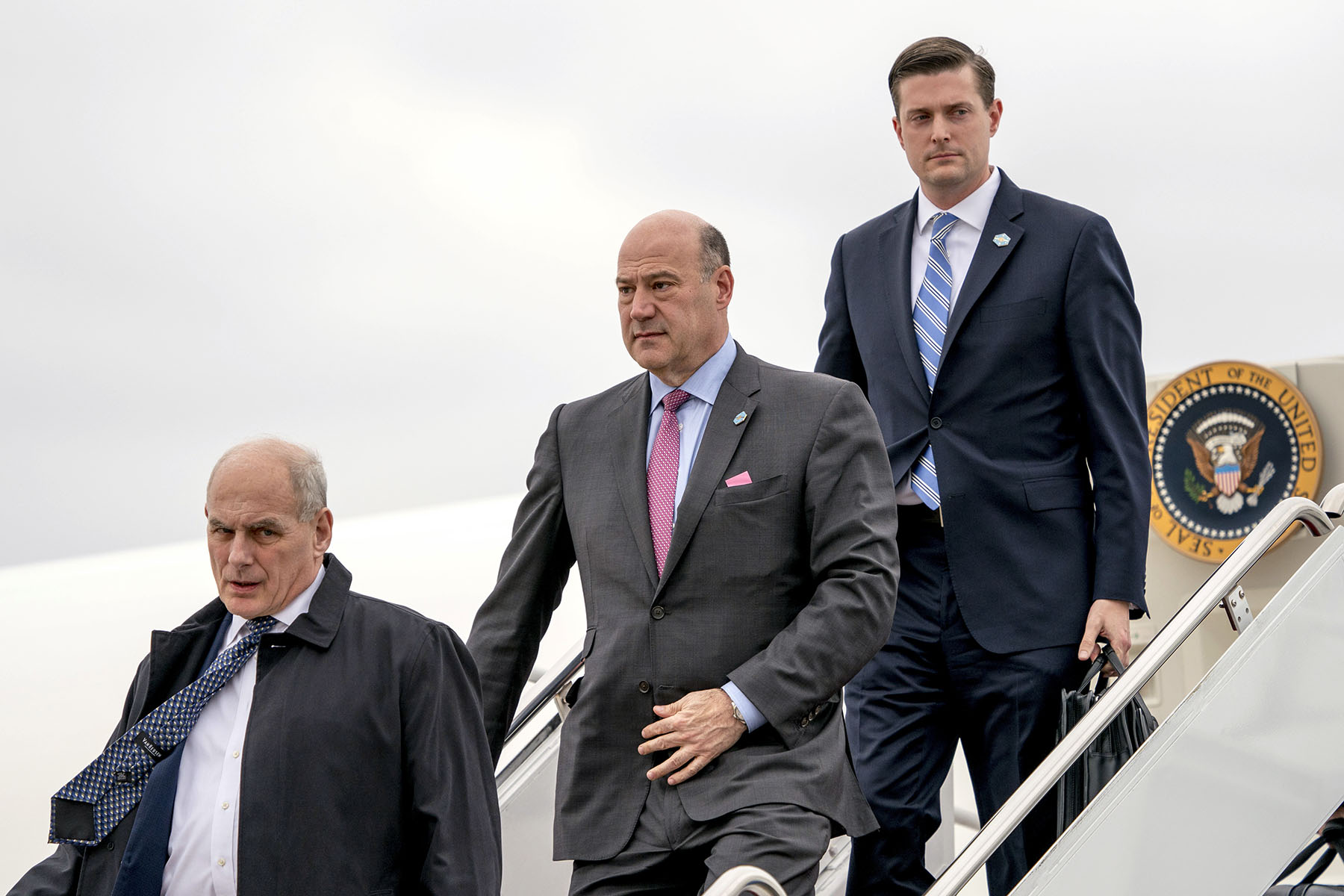 John Kelly (left), Gary Cohn (center) and Rob Porter arrive at Andrews Air Force Base in Maryland.