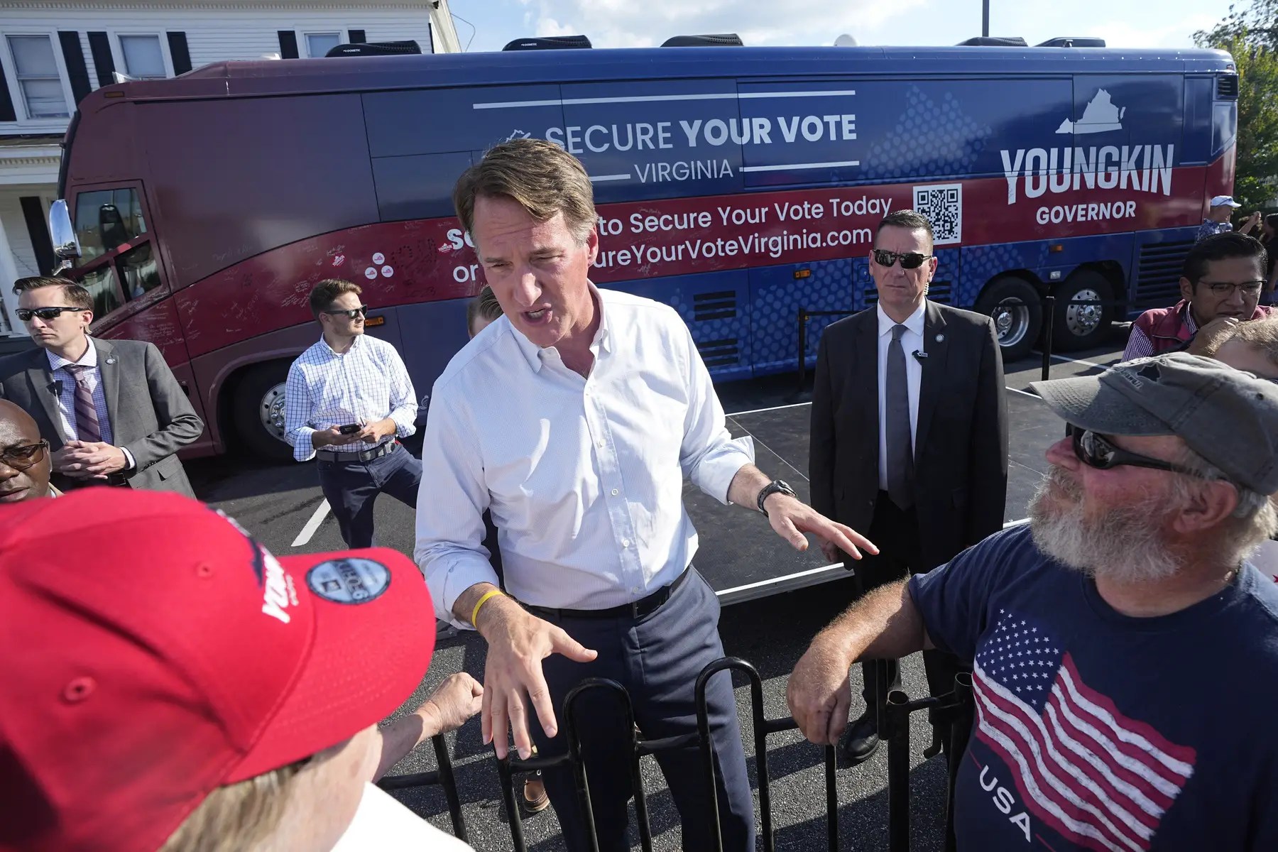 Virginia Gov. Glenn Youngkin talks to supporters during an early voting rally.