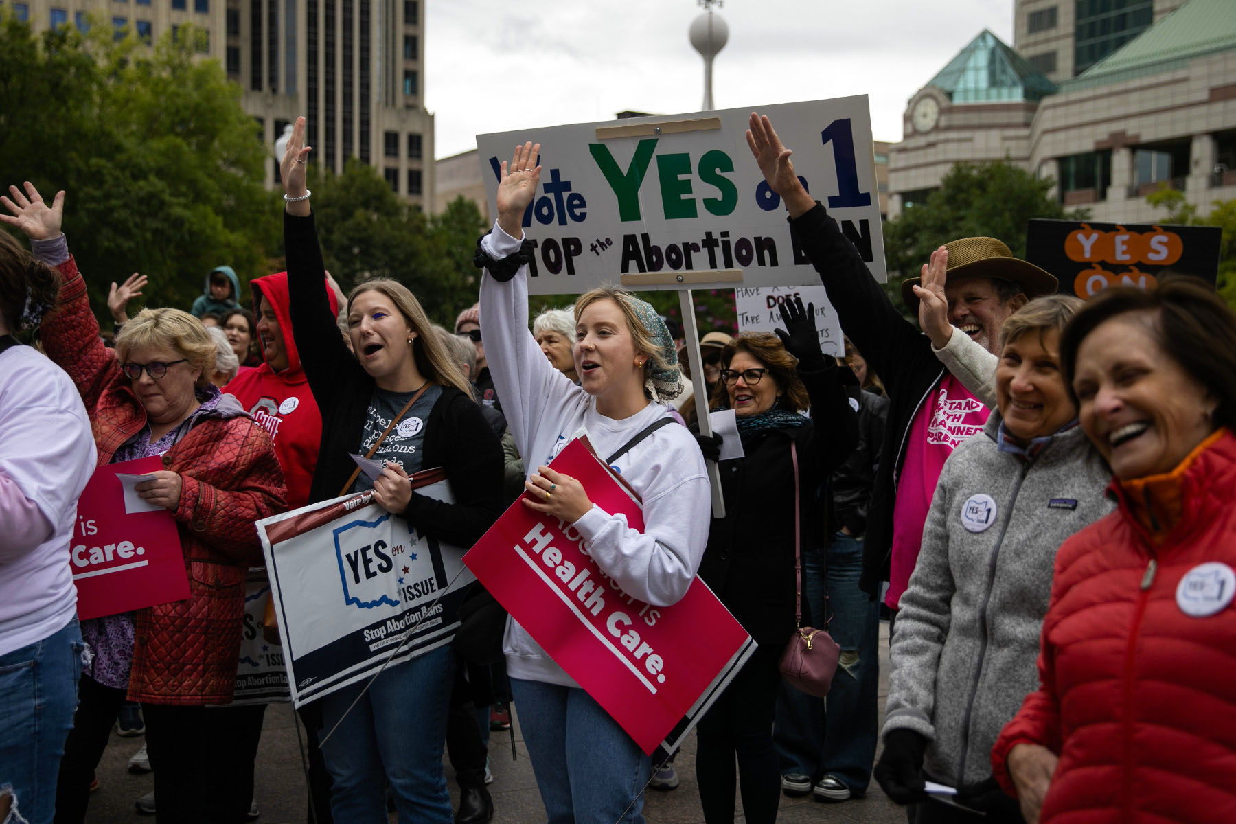 People attend a rally hosted by Ohioans United for Reproductive Rights outside of the Ohio Statehouse.