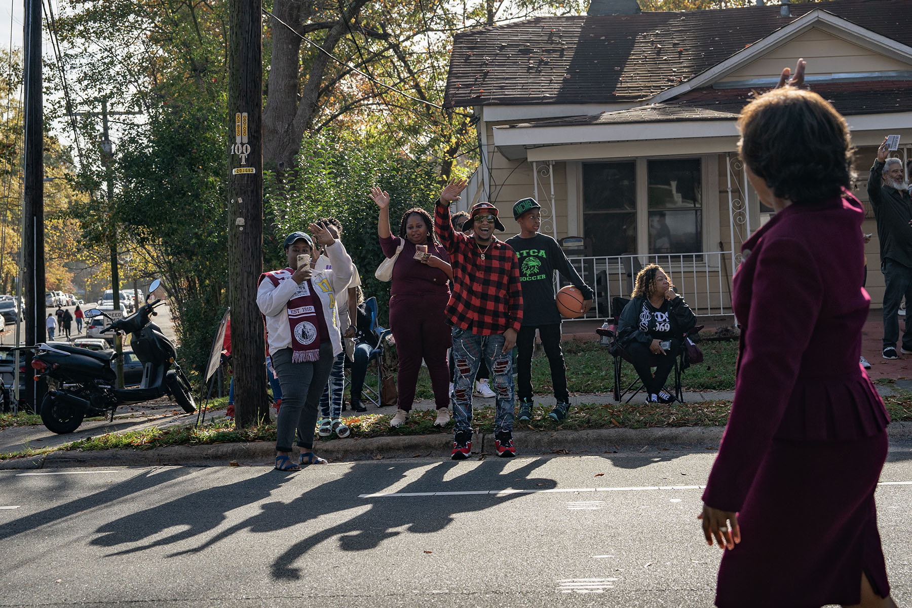 People cheer for Cheri Beasley as she walks in the North Carolina Central University Homecoming Parade.