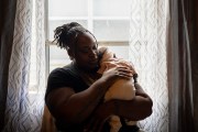 O'Laysha Davis holds her 3-month-old daughter, Journee’ Divine Stokes, in her arms at her home.