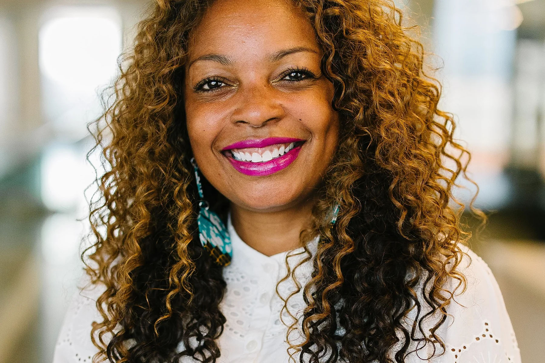 Roslyn Harmon smiles as she looks at the camera.