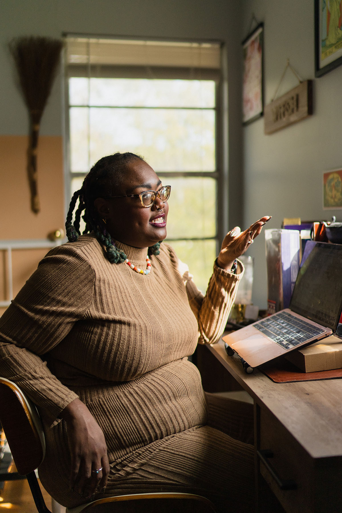 Portrait of former Emerge Texas Executive Director Serita Fontanesi speaking at her desk at home.