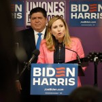 Former Congresswoman Debbie Mucarsel-Powell speaks at a podium during an event.