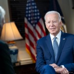 President Joe Biden participates in an interview in the Map Room of the White House.