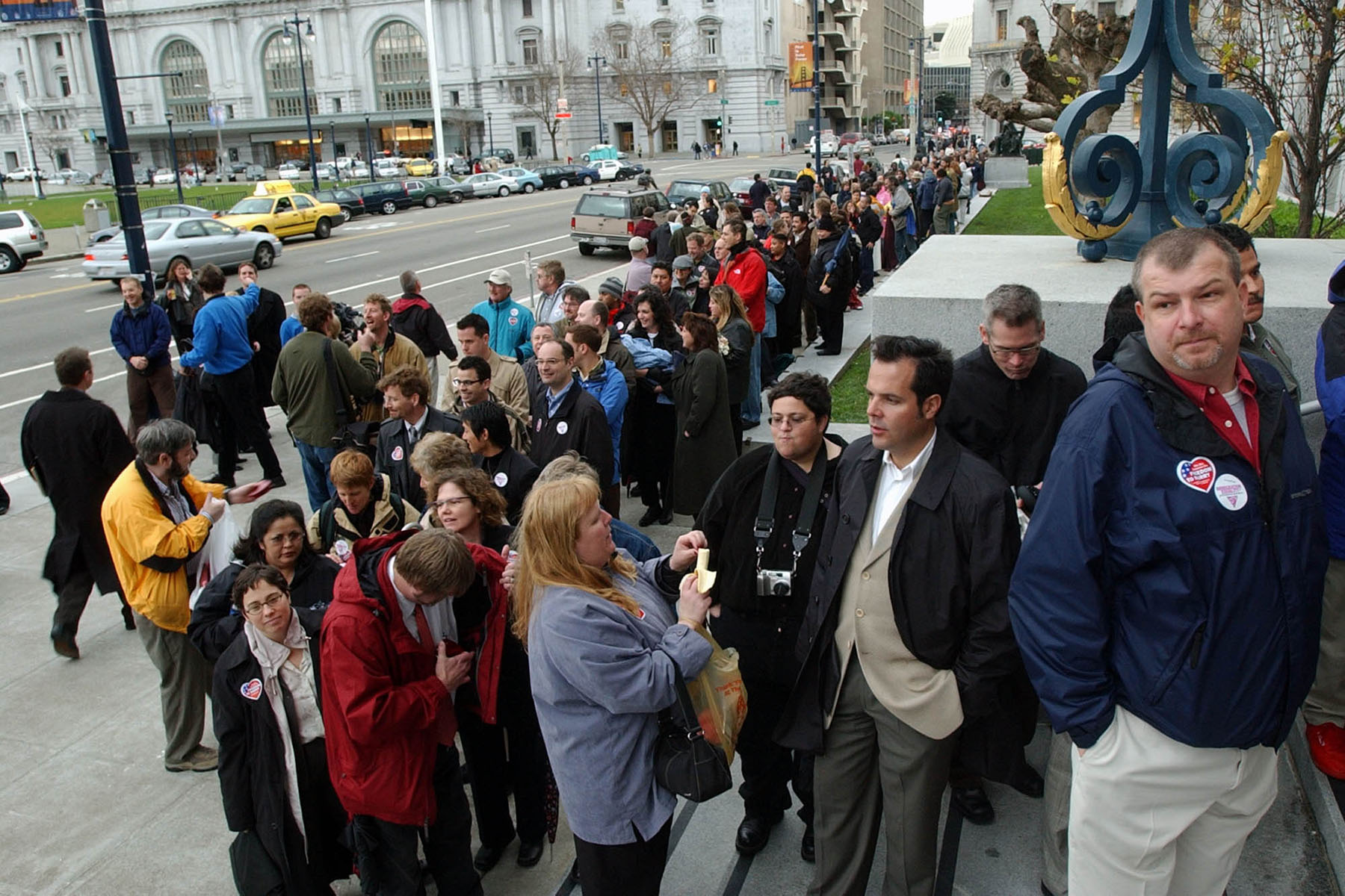 Hundreds of couples wait in line to be married outside City Hall in San Francisco.