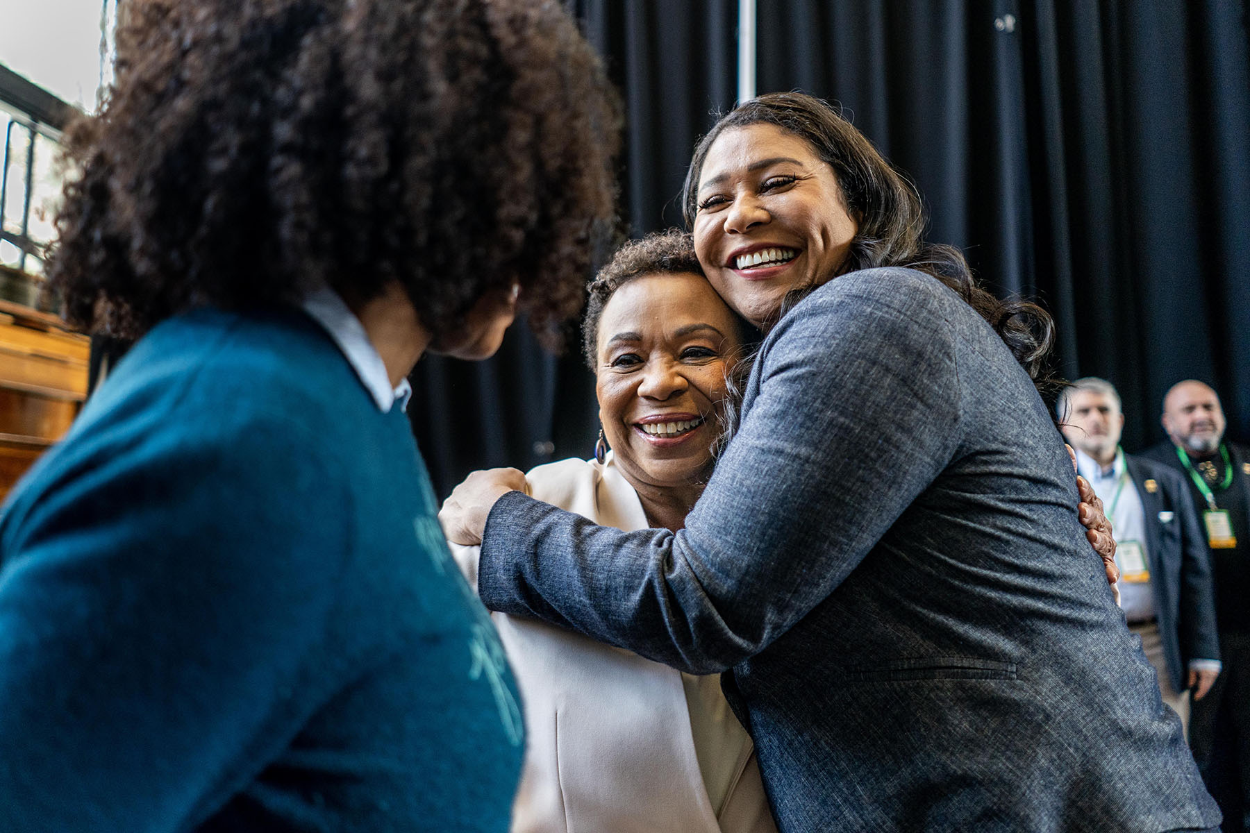 San Francisco Mayor London Breed hugs Barbara Lee.