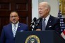 President Joe Biden is joined by Education Secretary Miguel Cardona at the White House lectern.